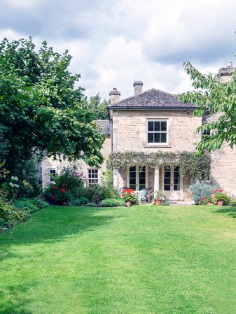 Brick house on a beautiful green lawn