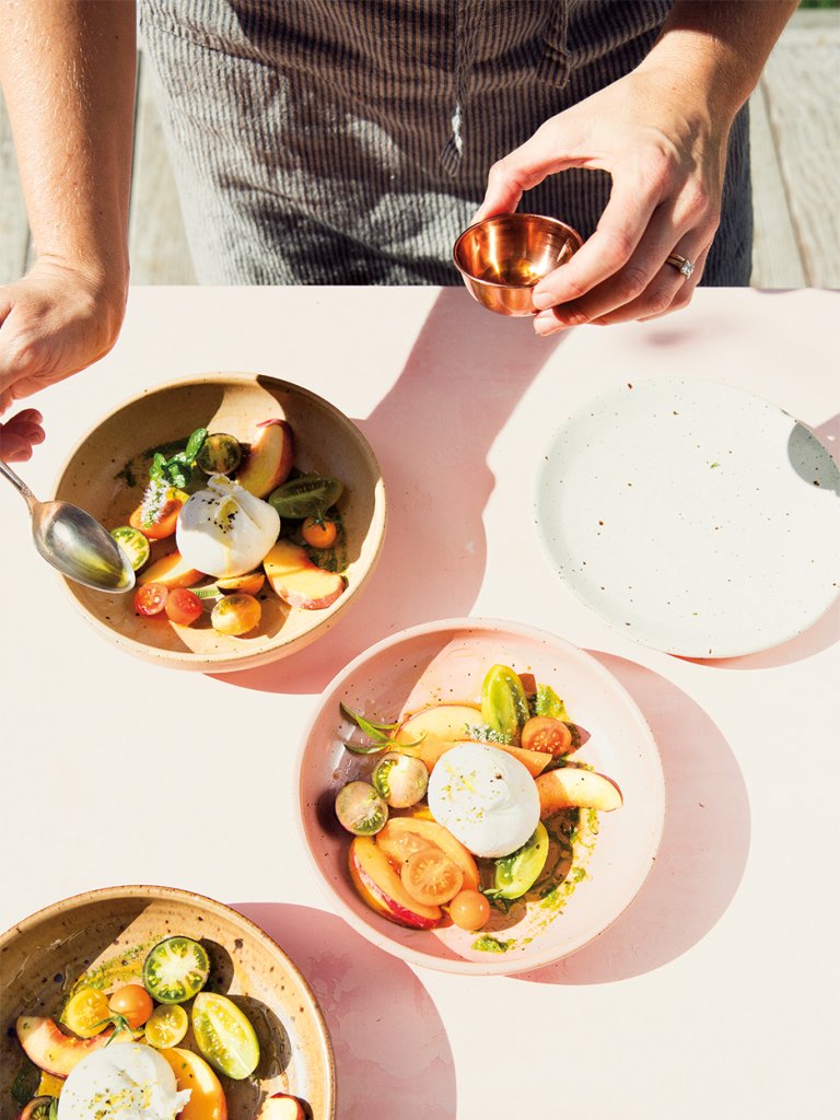 Chef making a salad with fruits and vegetables