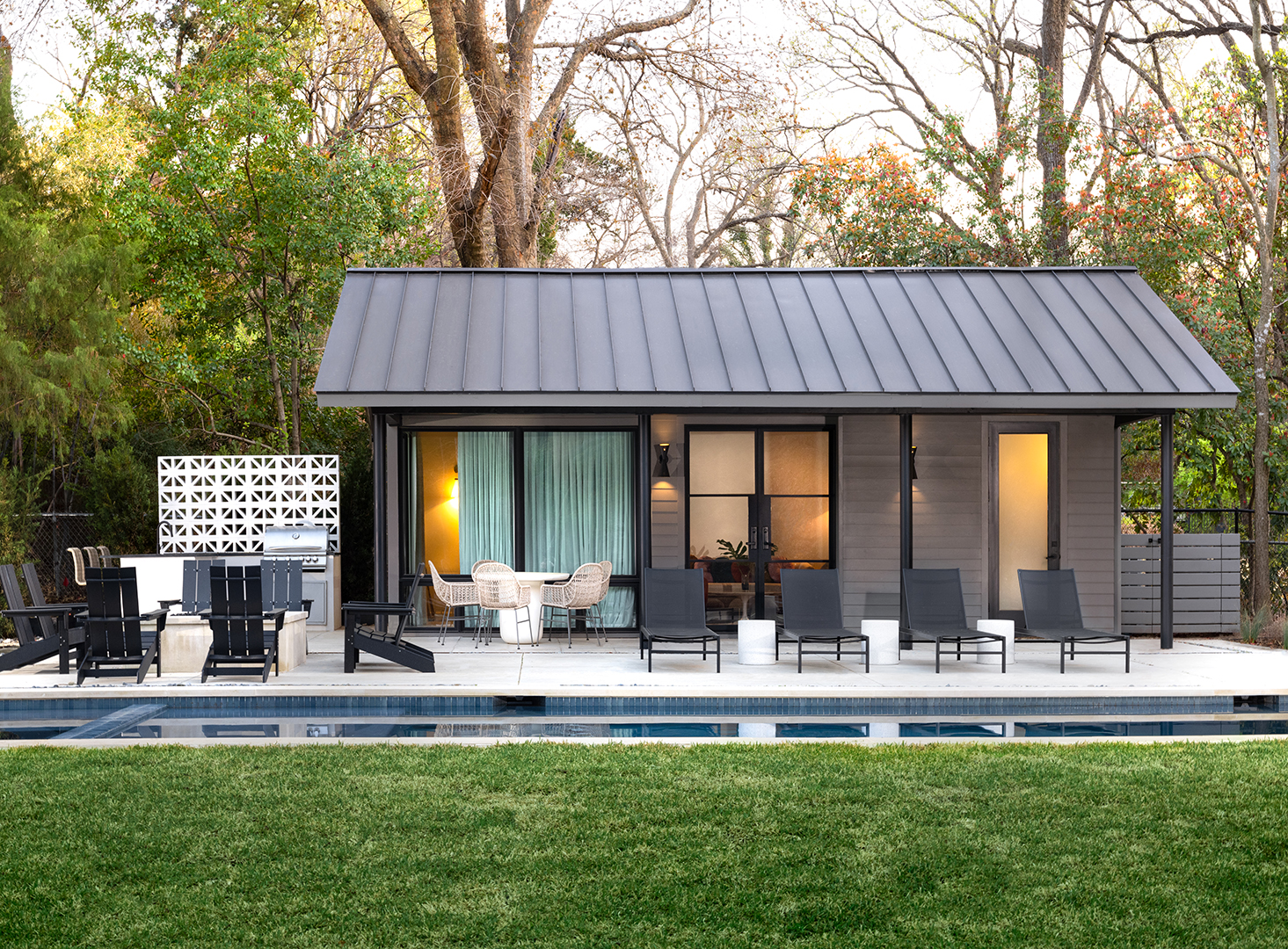backyard area with matte black wall mounted sconces