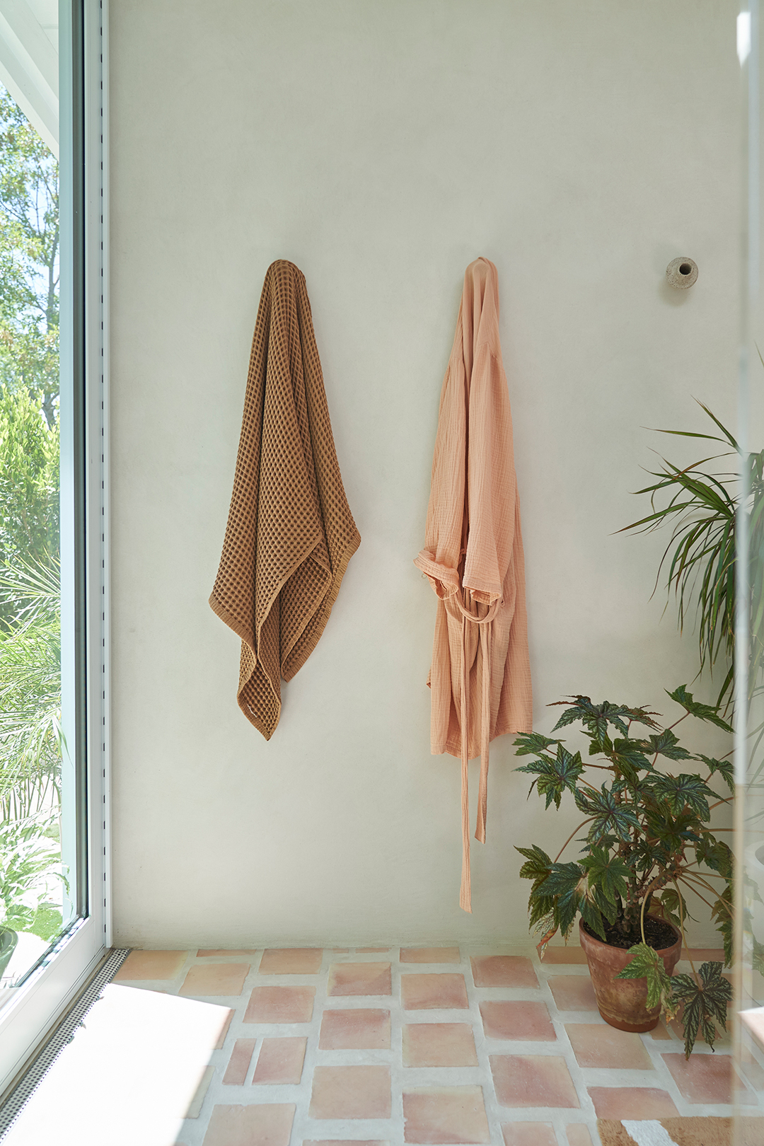 robes hanging in shower