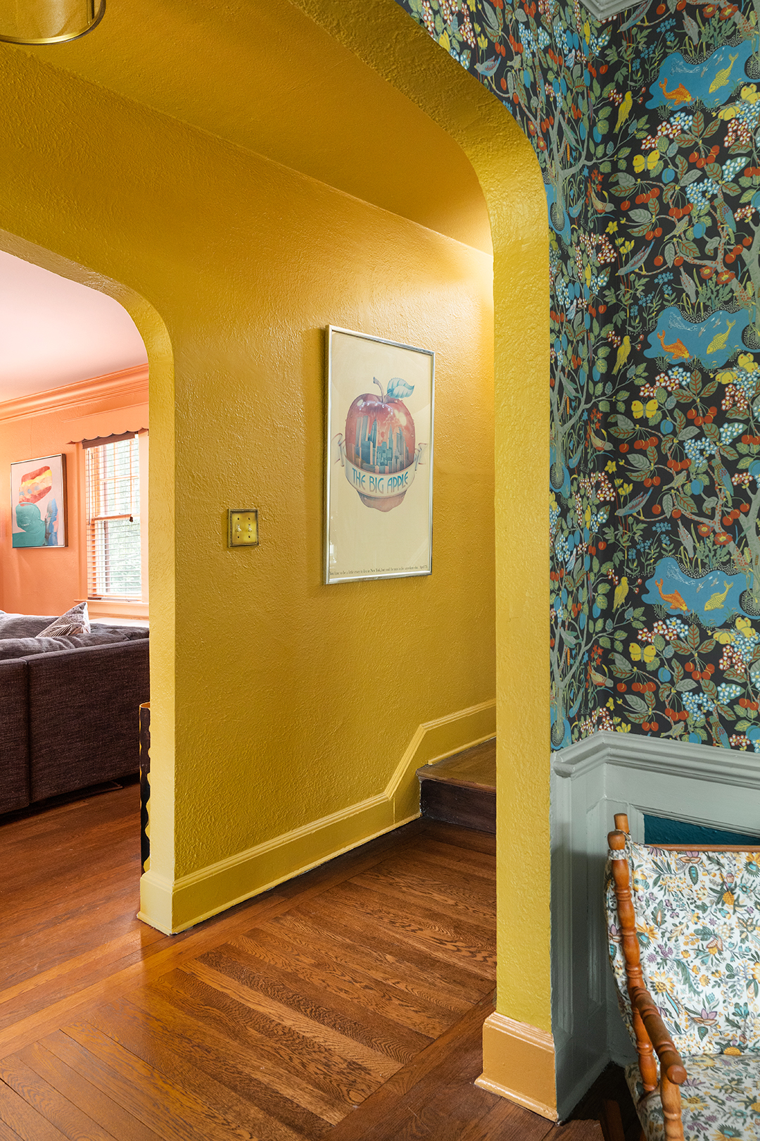 yellow hallway off green dining room