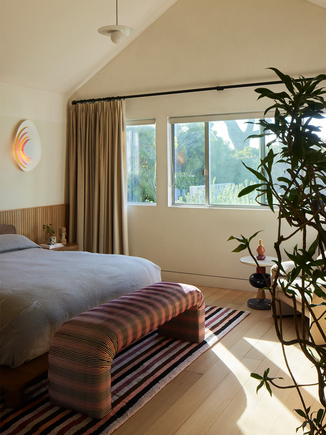 striped bench at end of bed