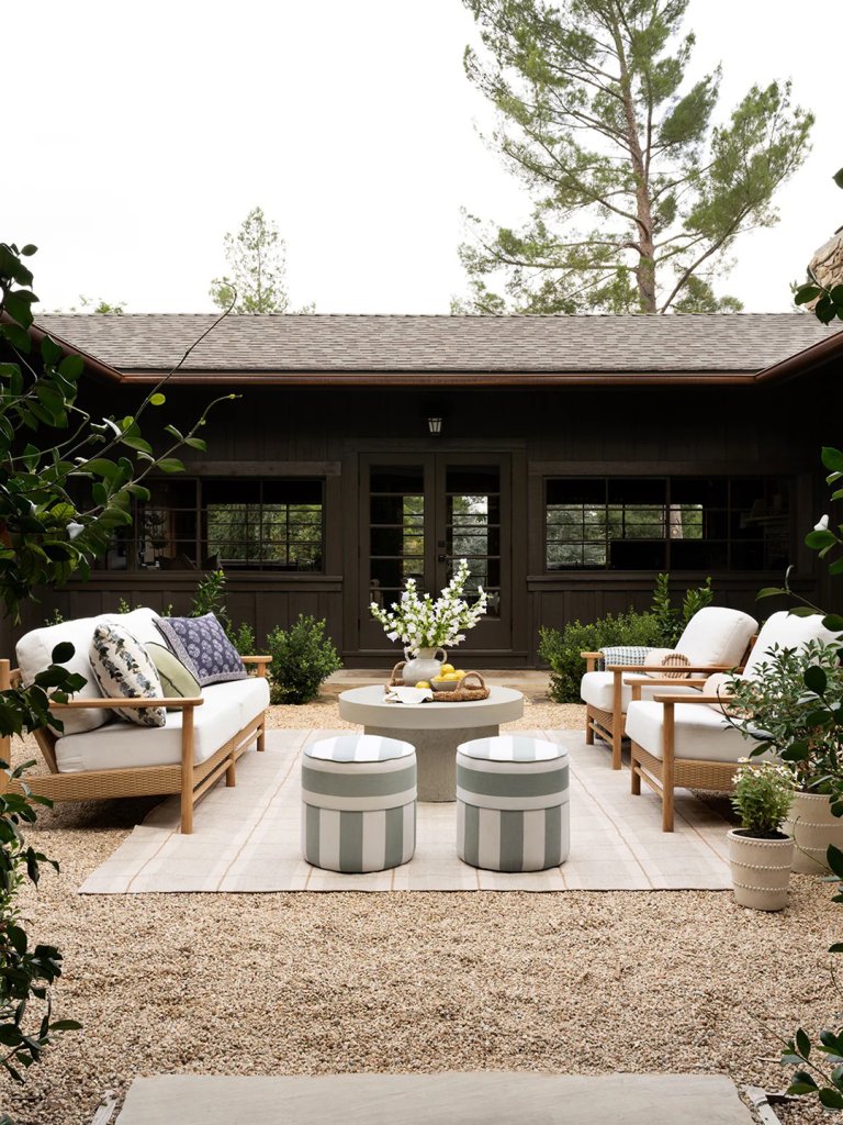 black house with gravel patio