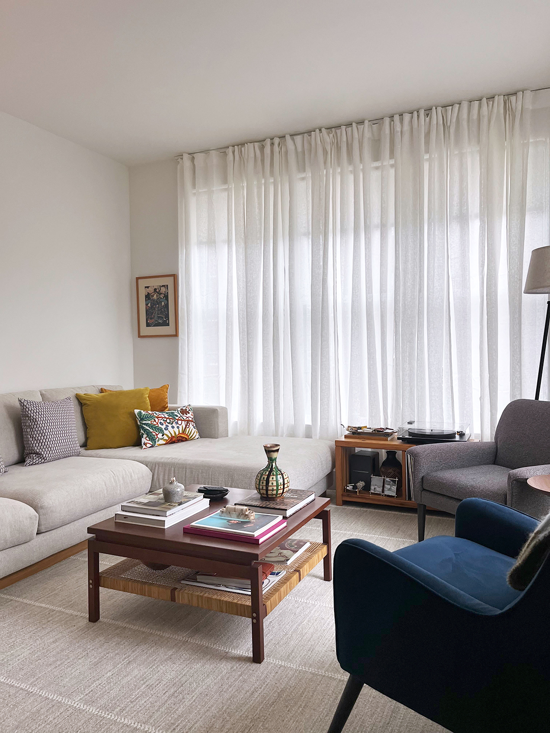 beige sofa and gray rug