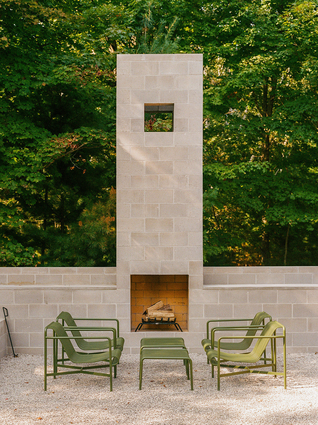 Outdoor fireplace with chairs